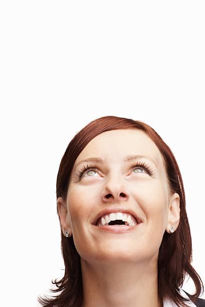 istock Happy middle aged woman looking up 183256875