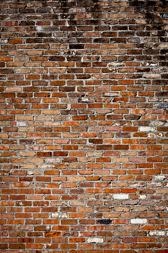 Brick wall in red color, old red brick wall texture background.