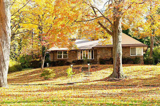 Living on the hill - autumn at upscale family house stock photo