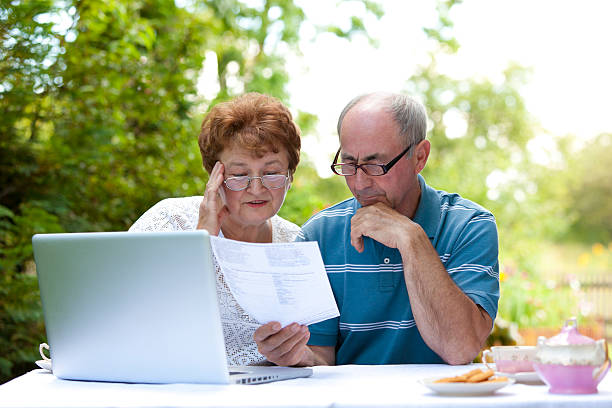 istock Sad senior couple goes over bills 183257639