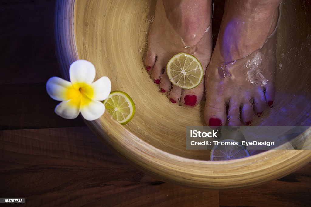 Woman Getting a Pedicure Woman soaks her feet at a beauty spa.  Horizontal shot Pedicure Stock Photo