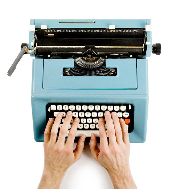 Hands on classic typewriter stock photo