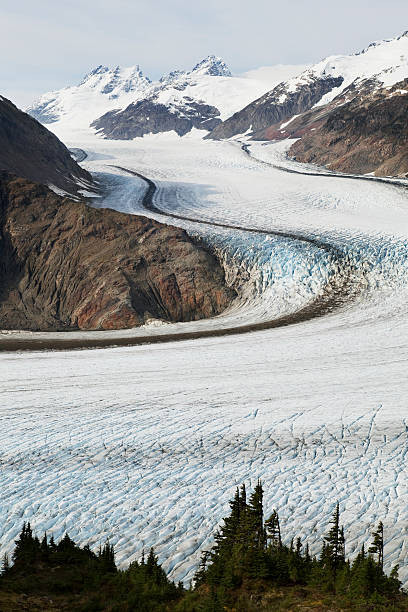 salmon glacier "Vertical shot of Salmon Glacier,the 5th largest in North America,near Hyder,Alaska.Please see some similar pictures from my portfolio:" salmon glacier stock pictures, royalty-free photos & images
