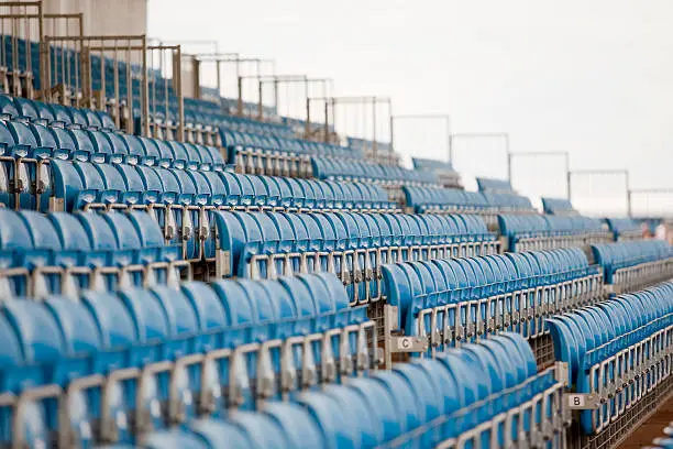 "Row of blue seats in empty stadium. Silverstone, England"