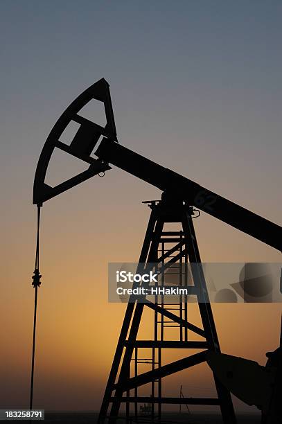 Pump Jack Silhouette In The Sunset Stock Photo - Download Image Now - Agricultural Field, Black Color, Checking the Time