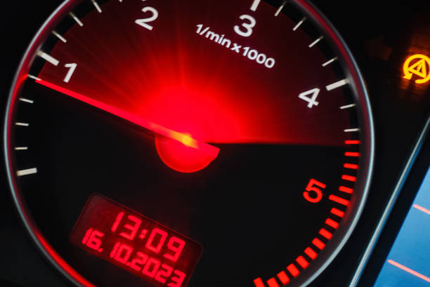 istock Motion blur of a car instrument panel dashboard odometer with red illuminated display.Car speedometer. High speed car speedometer and motion blur at night. 1832593958