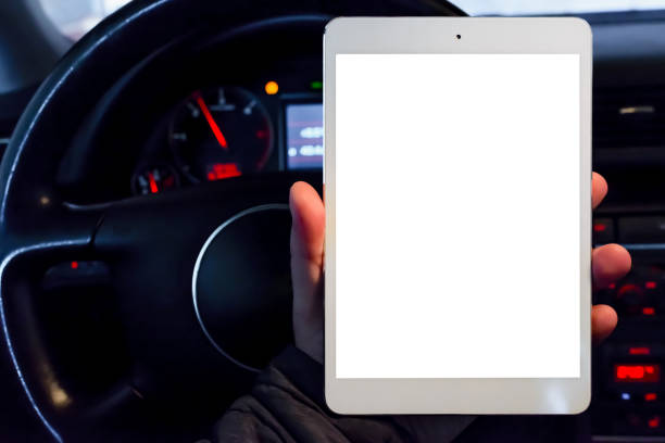 istock Mockup white screen.A mechanic looking at pc digital tablet in a car service garage.car engine test dashboard.Transportation service and maintenance working action. 1832593962