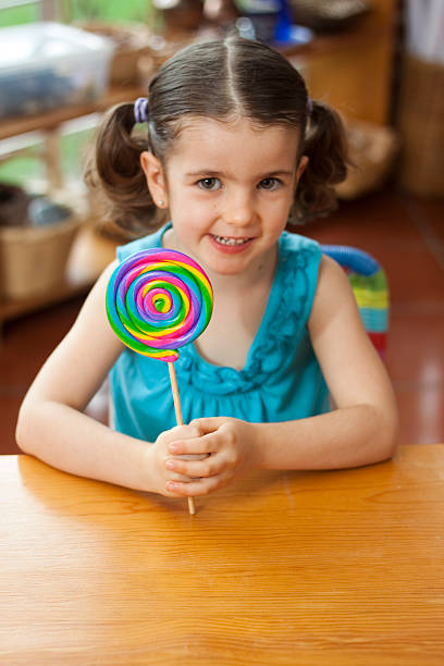 istock Little girl with lollipop 183259828