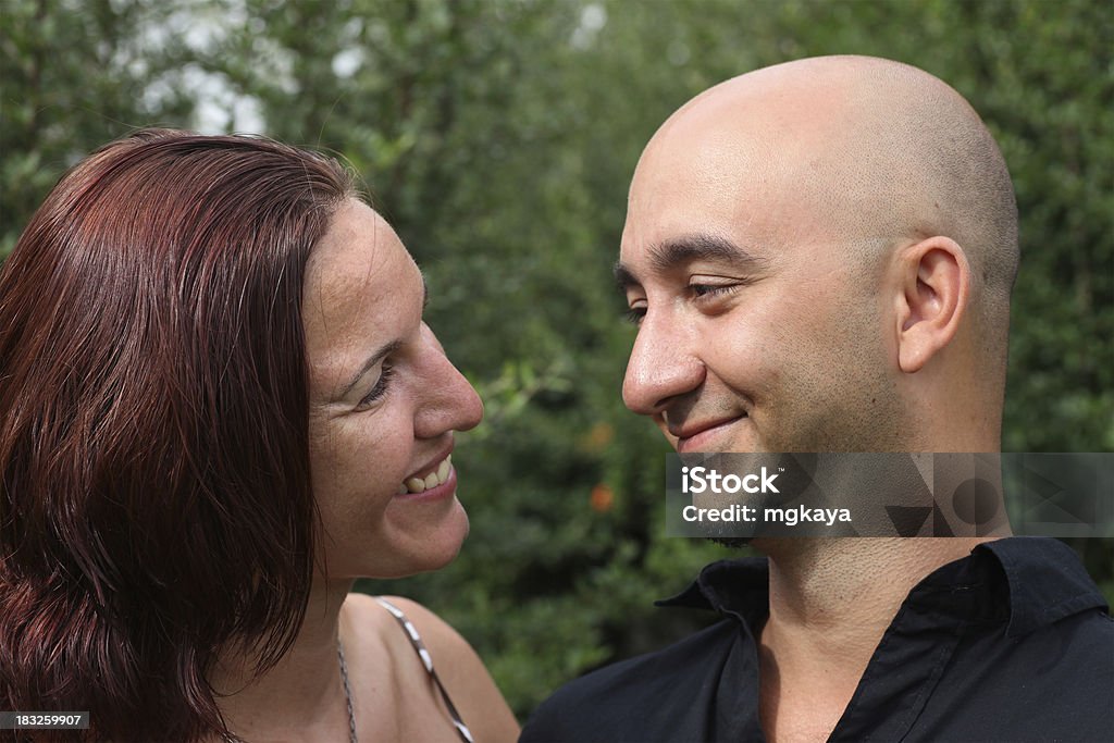 Happy Couple Portrait of happy young couple at the park. 30-34 Years Stock Photo