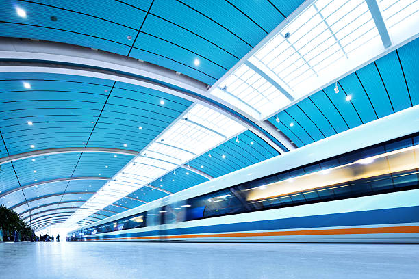 Futuristic Train "Futuristic Train in Shanghai, ChinaShanghai Maglev Train or Shanghai TransrapidMagnetic levitation train - the fastest passenger train currently in service (431km/h) Long Exposure , Blurred Motion" aerodynamic photos stock pictures, royalty-free photos & images