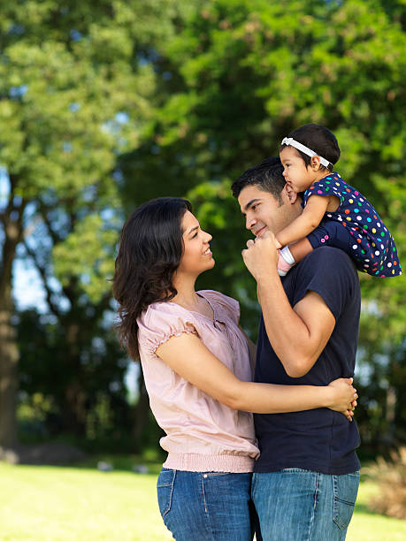 istock Latin couple with their baby 183260352