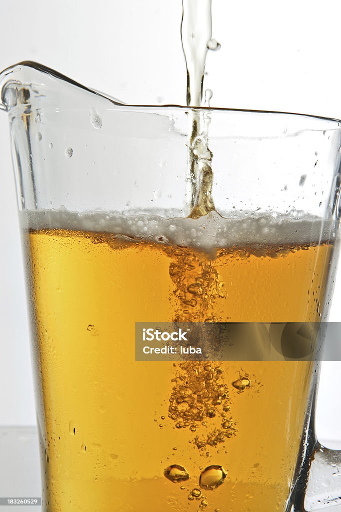 Pitcher Being Filled With Beer A pitcher being filled with beer Beer - Alcohol Stock Photo