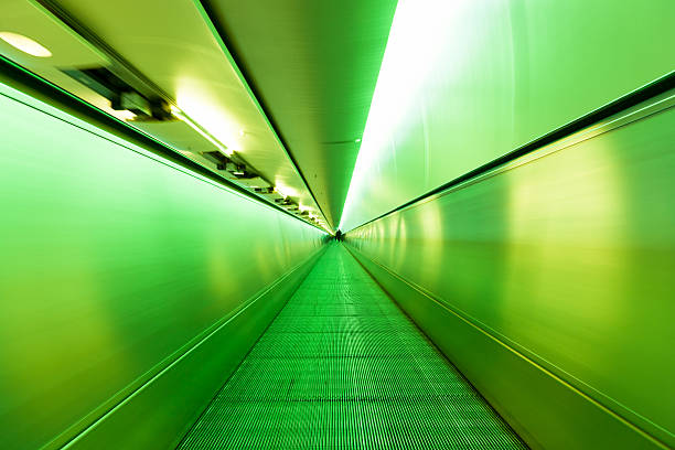 istock Airport Elevated Walkway Lime Green Illuminated Tunnel 183260565