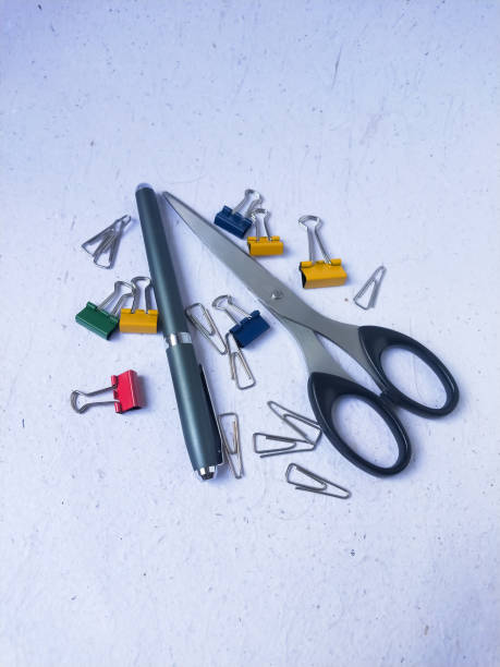 istock Stationery, scissors and binder clips on a white background. 1832608425