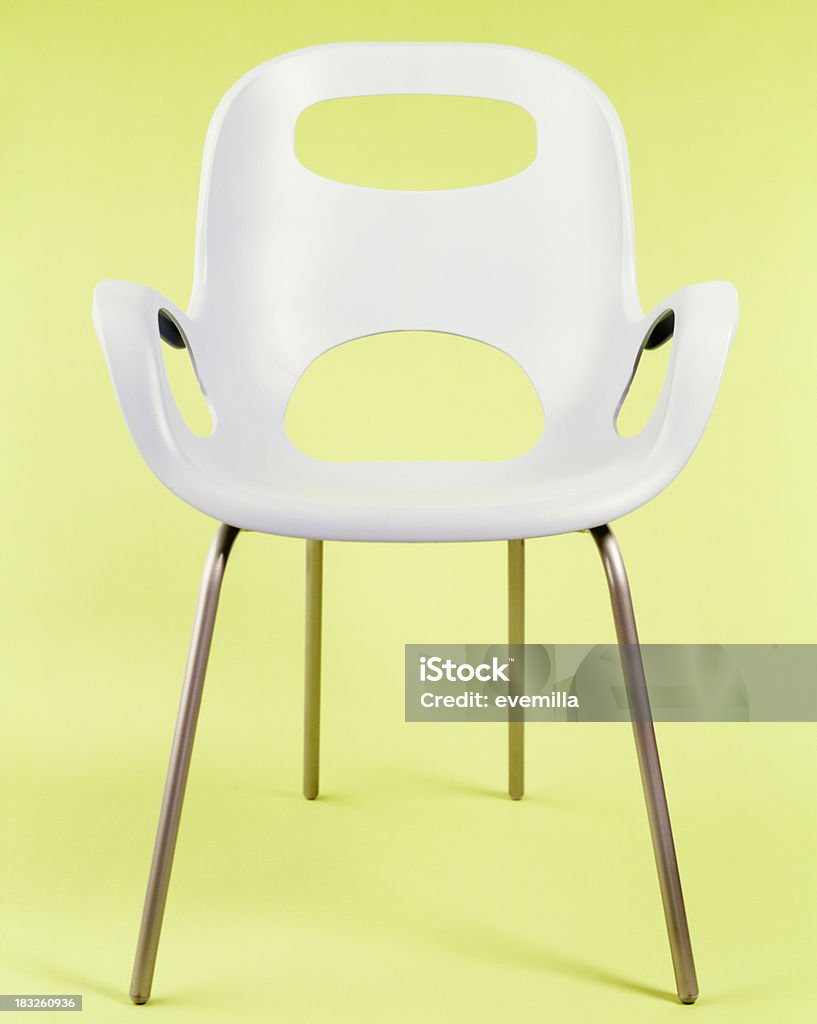 modern white chair modern white chair on green background Furniture Stock Photo
