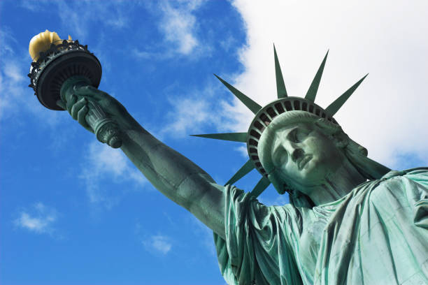 istock Vertical shot looking up at Statue of Liberty on sunny day 183261008