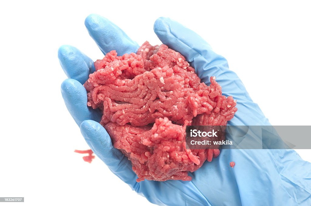 testing mincemeat in laboratory with blue gloves close-up picture of fresh mincemeat in human hands with blue gloves Beef Stock Photo