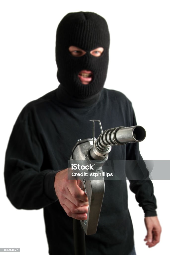 Ploceus Robber segurando um bocal da bomba de combustível - Foto de stock de Ladrão royalty-free