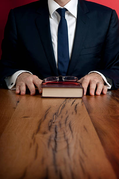 istock Businessman, book and glasses 183262198