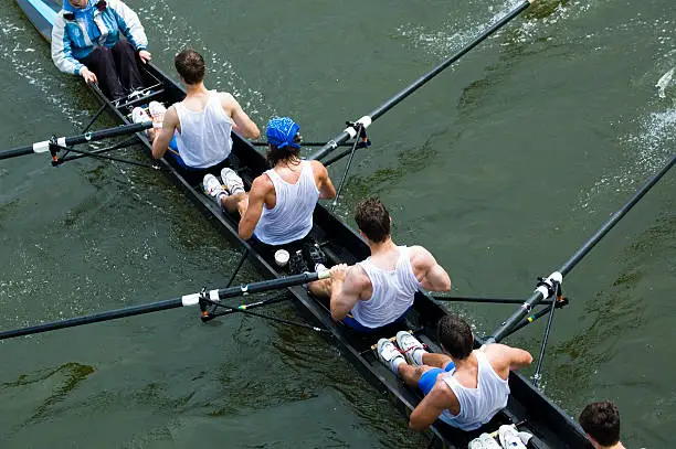 Photo of Men paddling viewed from above lake