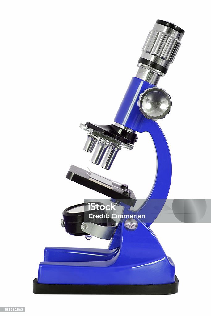 Microscopio su bianco - Foto stock royalty-free di Microscopio