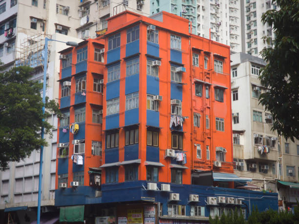 a 5-storey colorful private building, surrounding by grey and white buildings in kolwoon, hong kong, friday, december 1,2023. - 12023 imagens e fotografias de stock