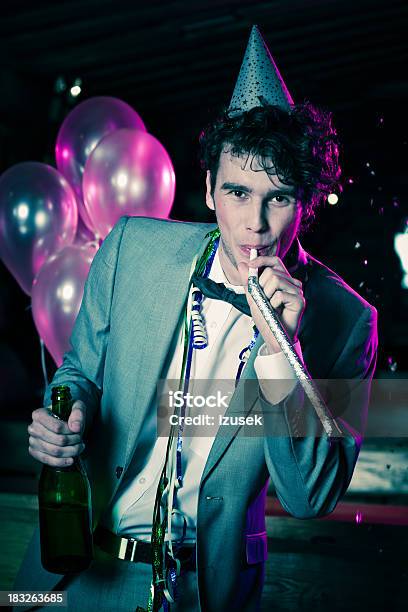 Young Man Celebrating New Years Day Stock Photo - Download Image Now - Celebration, Gel Effect Lighting, Happiness