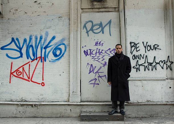 istock Urban man against graffiti wall - Series 183264053