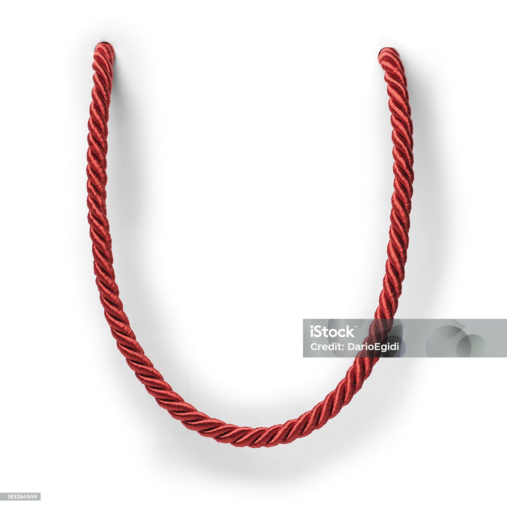 Cadena roja sobre fondo blanco - Foto de stock de Cuerda libre de derechos