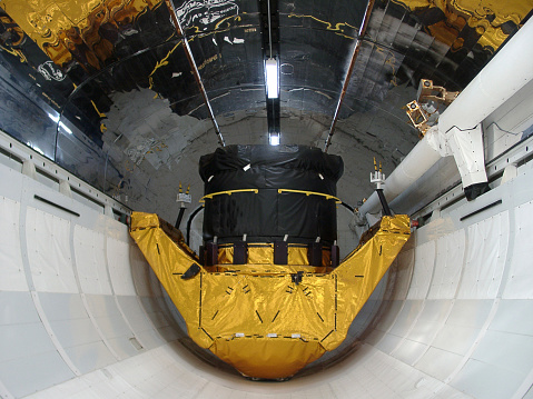 satelite inside space shuttle cargo hold