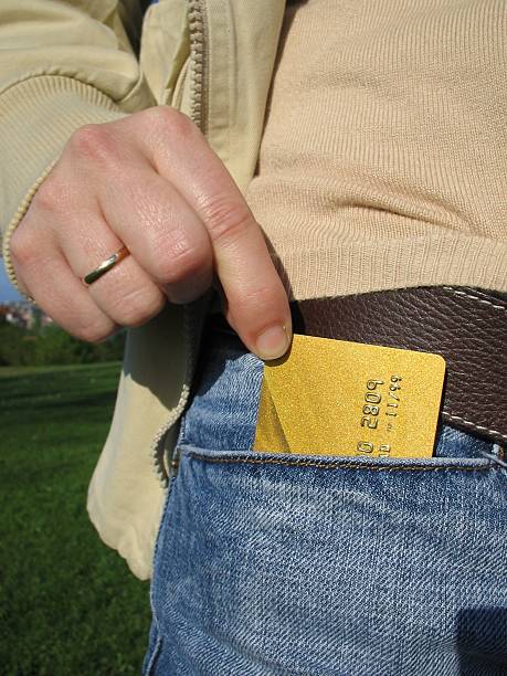 Credit card on jeans stock photo