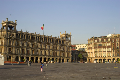 mexico city town hall at zocalo plaza (strange perspective because both buildings are inclined at the corner)