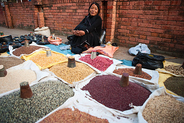 Nepali street seller - selling beans and spices.http://bem.2be.pl/IS/nepal_380.jpg