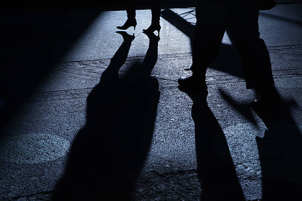 istock Male following female into blue night shadows 183265543