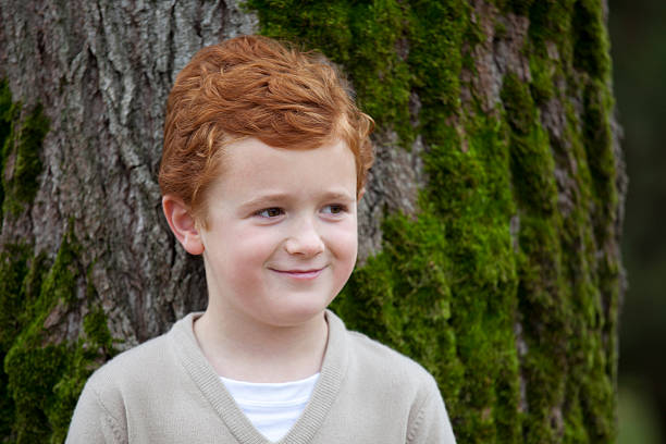 istock Young boy outdoors for family portrait 183265617