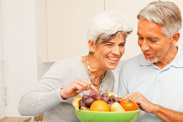 istock senior couple in the kitchen 183265911