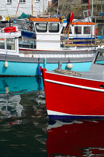 Colourful fishing boats in the harbour, Polperro, Cornwall, UK