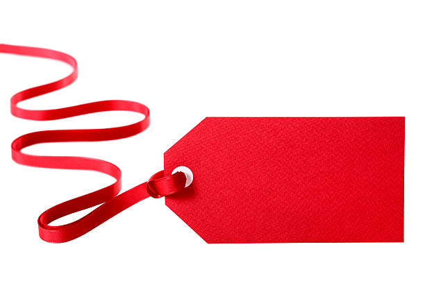 istock Red price tag with red ribbon attached against white back 183266392