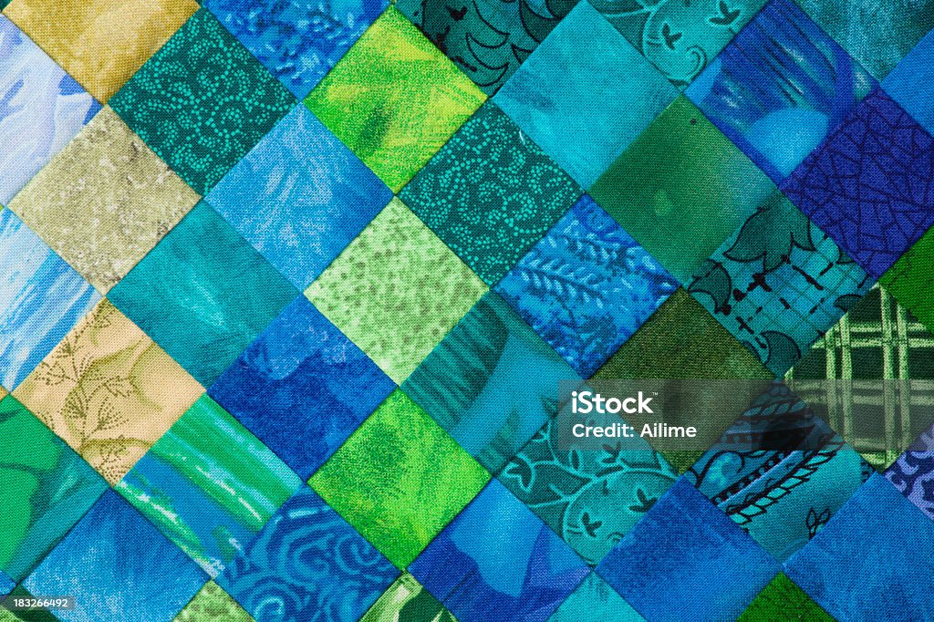 Quilt background High resolution close up of tiny 1 inch square fabrics pieced together into a quilt. Quilt Stock Photo