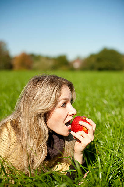istock Blond Eva eating the forbidden fruit 183267147