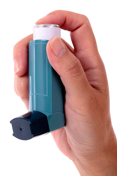 istock Asthma inhaler held in a female hand 183267169