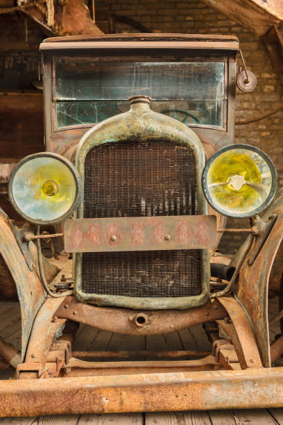 istock Early twentieth century rusted and broken classic car 1832674253