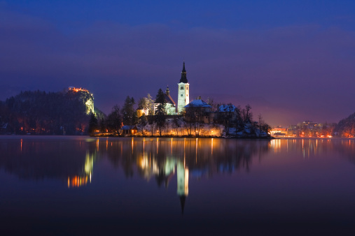 Lake Bled located in Slovenia Europe. There is a Church on the Island and ancient castle on top of a rock.