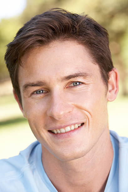 istock Portrait Of Young Man Relaxing In Park 183267737
