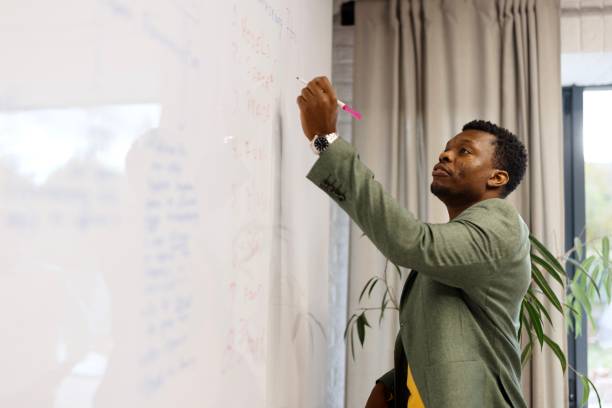 istock Picture of a man presenting his ideas in the modern office 1832681630