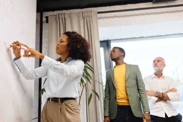 istock Business woman presenting her ideas in the modern office 1832681633