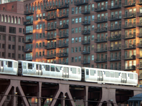 Elevated train in Chicago with city apartment building in backgroundSee other images of Chicago in my portfolio: