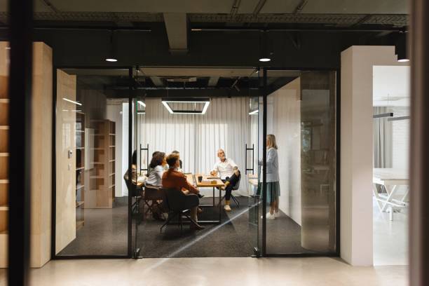 istock Coworkers talking about work on a business meeting 1832682779