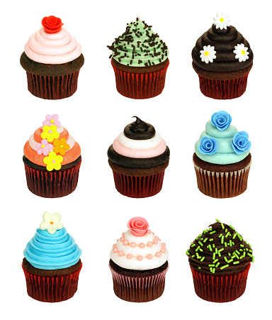A collection of lovely chocolate cupcakes, precision isolated on 255 white.