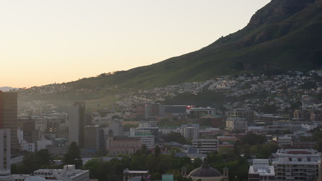City, buildings and drone by mountains, landscape and metro architecture, development and expansion in nature. Skyline, infrastructure and civil engineering for urban cityscape, outdoor and Cape Town